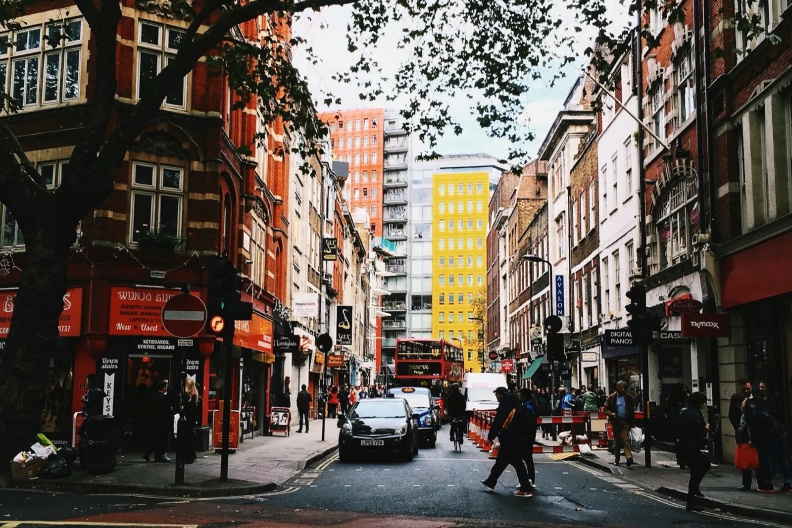 Yellow criss-cross box junction markings across a busy London junction