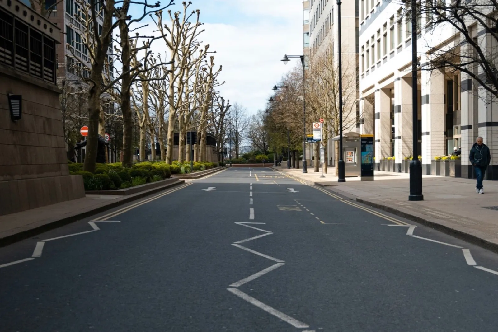 White zigzag markings on the approach to a pedestrian crossing on a London street